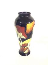 A Moorcroft vase from 2005. 21cm by 10cm. Postage