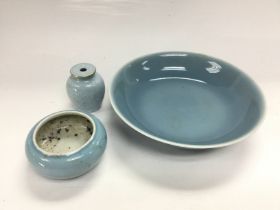 Three pale blue ceramic items comprising a dish, a