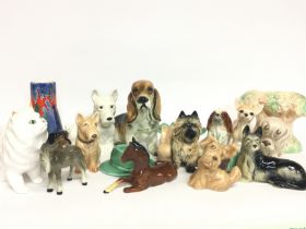 A collection of Sylvac ceramics including dogs and