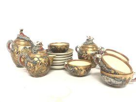 A 1920s Japanese tea set with satsuma cups plates