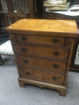 A 20th century walnut Bachelor type chest with a h