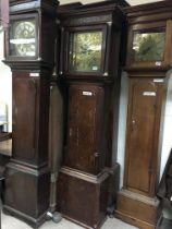 An oak long case clock, the brass dial having Roma