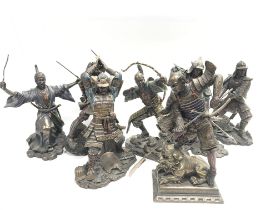 A collection of modern resin Samurai figures , approximately 24cm tall.