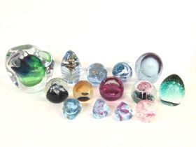 A collection of paperweights including Caithness g