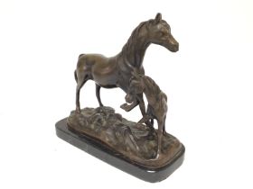 A bronze horse and foal. 24cm wide and 22cm tall.