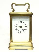 A French brass cased carriage clock, with a cracke