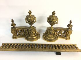 A small gilt brass and cast iron fire surround. Po