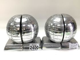 A pair of modern aluminium globe bookends. (D) NO