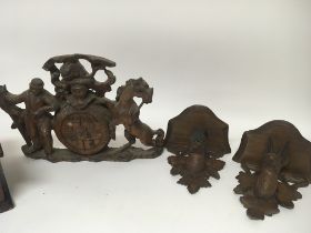 A pair of Black forest carved wood wall brackets i