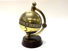 A Charles Frodsham brass globe clock, serial numbe