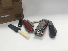 A small collection of pen knifes.