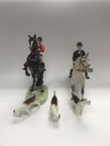 A set of beswick horses and hounds.