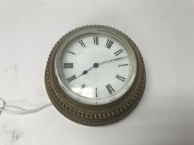 A brass desk clock.