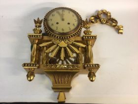 A 20th century gilt wood clock. 33cm wide and 47cm