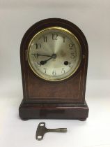 An eight day inlaid mahogany mantle clock, approx