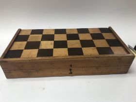 A folding chess set with unusually large chess pie