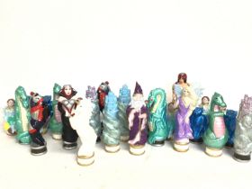 A large chess set of Mythical design , postage cat