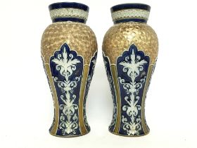 A pair of Royal Doulton Lambeth vases, approximate