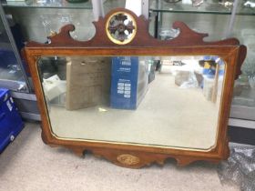A Georgian inlaid mahogany wall mirror with carved