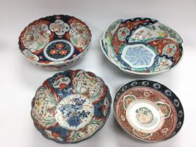 A box of Oriental ceramics comprising bowls, figur