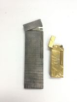 Two vintage lighters comprising a large Dupont and