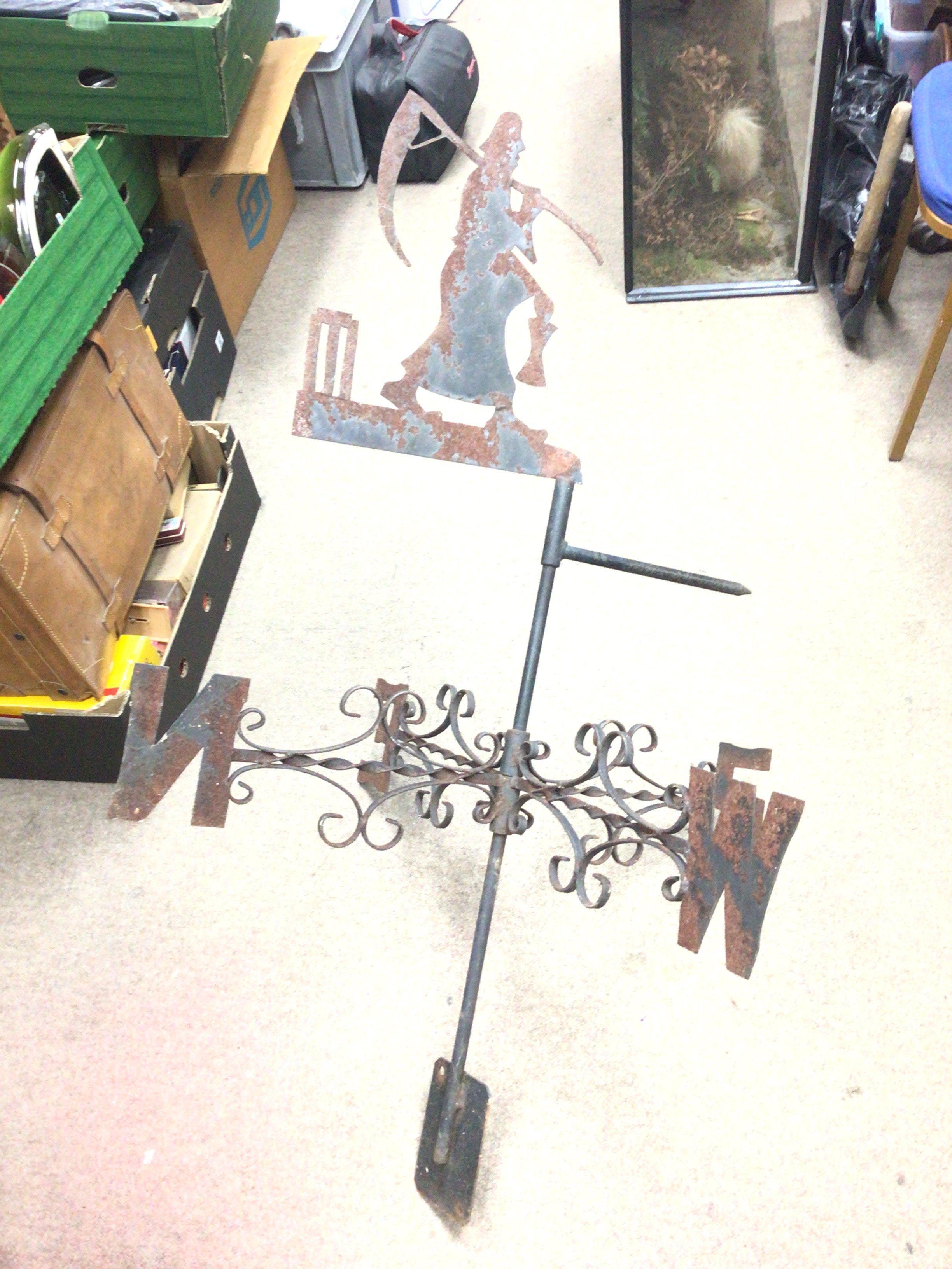 A vintage cast iron Weather Vane with the Father T