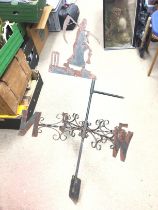 A vintage cast iron Weather Vane with the Father T