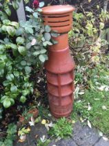A terracotta chimney pot with applied cap. Sold in