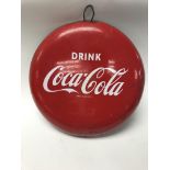 A mid 20th century vintage Coca Cola enamel button