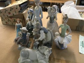 A collection of figurines including Lladro .