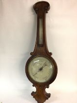 A Salmon and sons walnut barometer. 32cm wide by 1