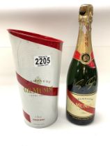 A Mumm brand champagne bottle signed by Formula 1