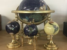 A gem stone globe together with three other smalle