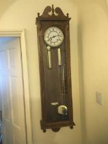 A modern oak two weight regulator clock with visib