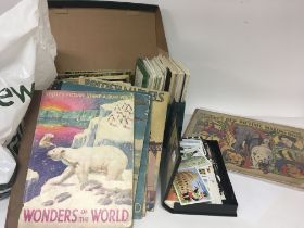 A collection of tea cards a Vintage Cadbury New Picture making book and other vintage books spare pl