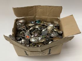 A large collection of collectors teaspoons. (D)