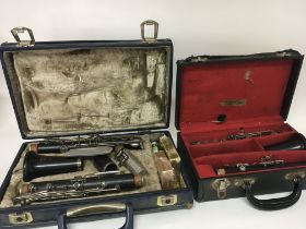 Two Cased clarinets maker Boosey Hawkes London in