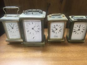 A Collection of four brass carriage clocks.