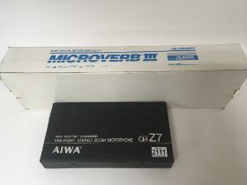 A boxed Microverb III and a boxed Aiwa zoom microp