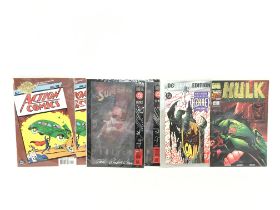 A collection of DC and Marvel comics, some signed