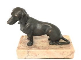 Bronze seated Dachshund on marble base , 8cm tall