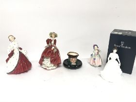 A collection of Royal Doulton figurines including