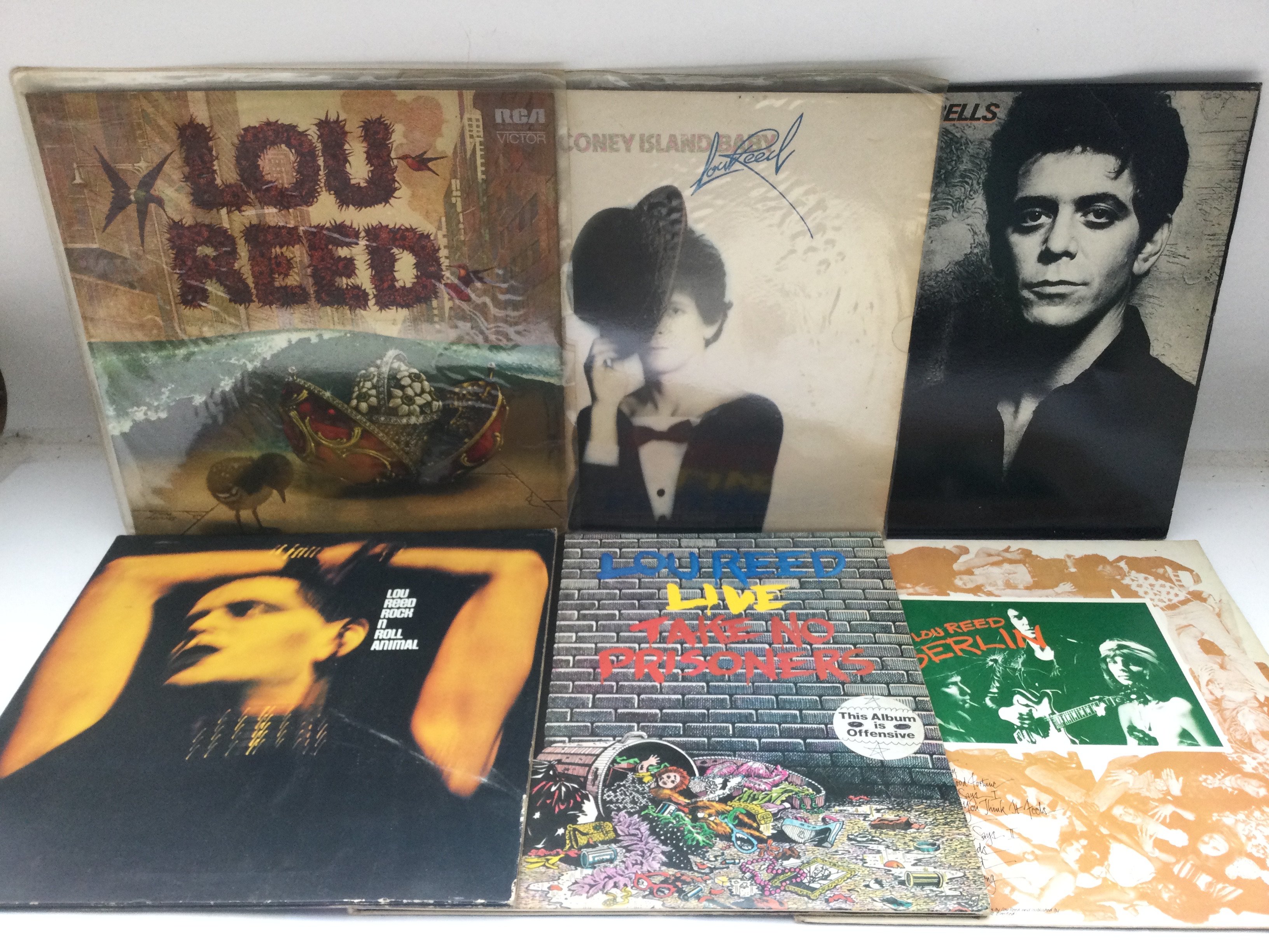 Thirteen Lou Reed LPs and 12inch singles comprising early UK pressings.