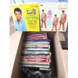 A collection of Elvis Presley 7inch singles and EP