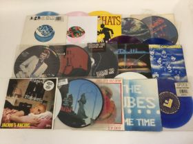 A collection of 7inch picture discs and coloured v