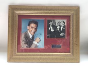 A framed and glazed photographic display signed by