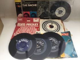 A box of 7inch singles and EPs by artists from the