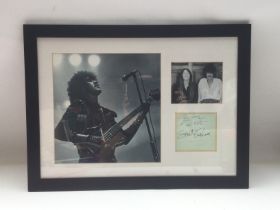 A framed and glazed montage of Thin Lizzy signed b