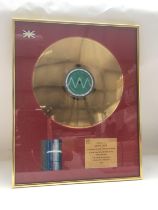 A framed and glazed BPI gold disc of Wings Over Am