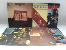 Six rock LPs by various artists including David Bo